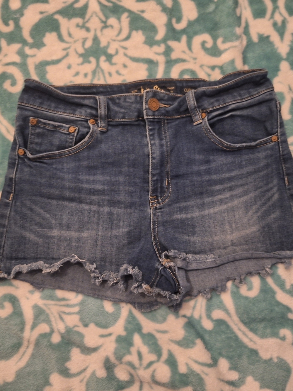 Indigo Rein Faded Blue Frayed Hem Jean Shorts